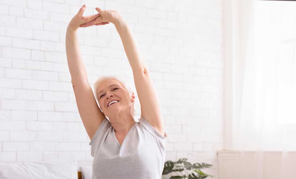 Well-rested senior stretching