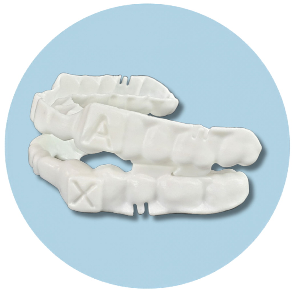 u shaped white medical grade plastic brace with both upper and lower jaw forms shown